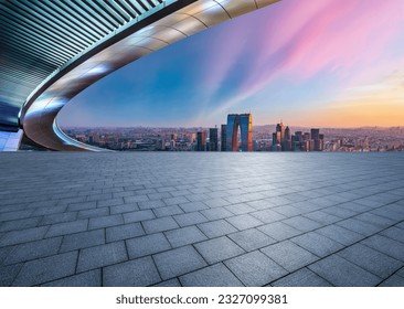 Empty square floors and city skyline with modern buildings at sunset in Suzhou, Jiangsu Province, China. high angle view. - Powered by Shutterstock