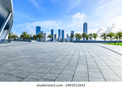 Empty square floors and city skyline with modern buildings under blue sky - Powered by Shutterstock