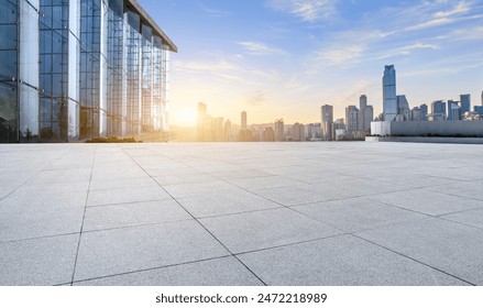 Empty square floors and city skyline with modern buildings in Chongqing at sunrise - Powered by Shutterstock