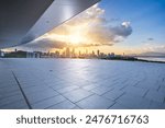 Empty square floors with modern city buildings scenery at sunrise in Shenzhen