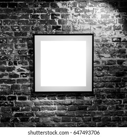 Empty Square Frame On Black Brick Wall. Blank Space Poster Or Art Frame Waiting To Be Filled. Square Black Frame Mock-Up