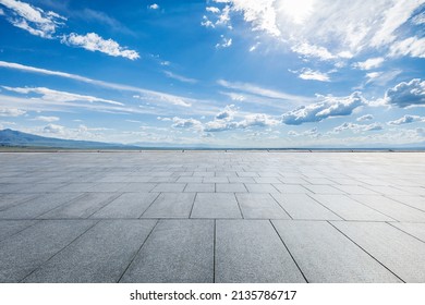 Empty square platform and blue sky with white clouds landscape - Shutterstock ID 2135786717