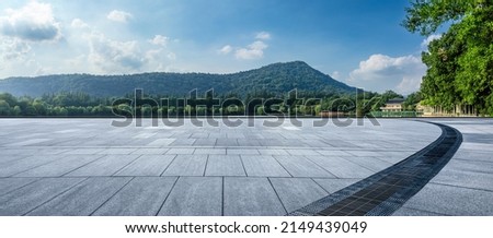 Empty square platform and green mountain with forest landscape in Hangzhou, China.