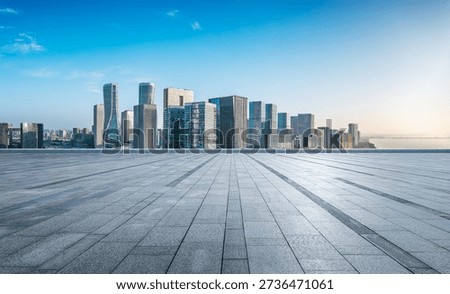Empty square platform and modern city skyline in Hangzhou, China.