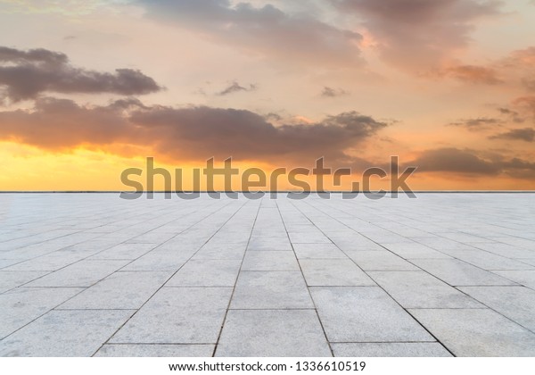 Empty square tiles\
and beautiful sky scenery