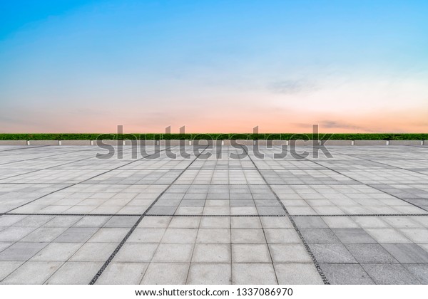 Empty square tiles\
and beautiful sky scenery