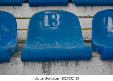 Empty Stadium Seats With Number 13 . Baker's Dozen Concept . Sports Superstitions