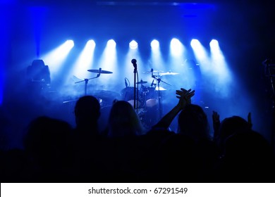 Empty Stage At Concert, Concert Crowd In Front Of Bright Blue Stage Lights