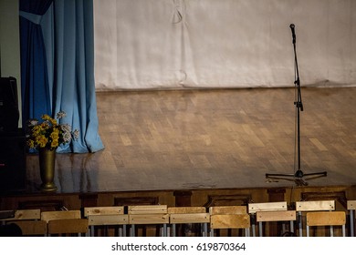 an empty stage and a microphone