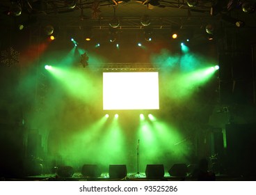 Empty Stage And Screen In The Rays Of Light Concert