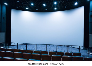 Empty Stage In The Small Movie Theater With White Isolated Screen