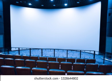 Empty Stage In The Small Movie Theater With White Isolated Screen