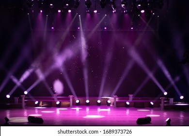 An empty stage of the theater, lit by spotlights and smoke before the performance - Shutterstock ID 1689373726