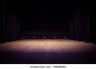 An empty stage of the theater, lit by spotlights before the performance - Shutterstock ID 598688681