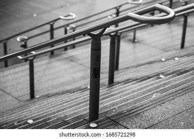 Empty stairs with rails on Wembly park tube station way dawn in black and white