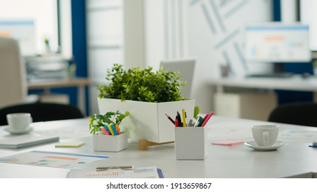 Empty start up business office, cozy light company room with conference table ready for brainstorming, modern design for meeting room. Financial company with nobody in it, workplace indoors concept.