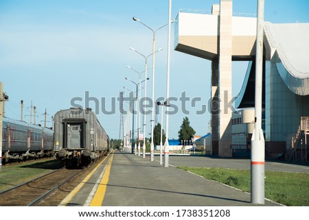 empty station platform in the summer, complete lack of people due to the virus, the concept of self-isolation and quarantine.
