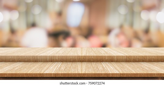 Empty step wood table top ( food stand ) with blur customer dining at cafe restaurant background bokeh light,Mock up for display or montage of product,Banner for advertising online media