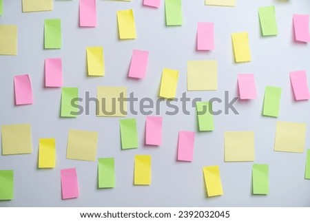 Empty sticky paper note on the wall ready to write wording