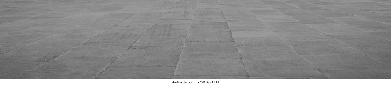 empty stone floor top in perspective. grey tile floor background in perspective view. line. empty copy space stone street. pavement. Granite outdoor tiled floor. gray granite. Marble texture