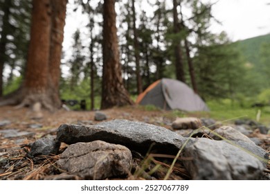 empty stone surface on the background of trekking camping tent