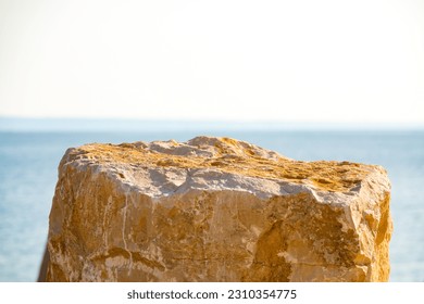 EMPTY STONE TOP AND SEA LANDSCAPE BACKGROUND, BACKDROP FRO REFRESING FOOD AND DRINKS, SUNNY SUMMER DESIGN - Shutterstock ID 2310354775