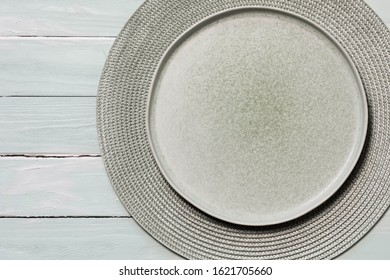 Empty Stone Trend Green Plate With Wavy Edge, Hot Frilled Or Cold Salad Plate In Wavy Pattern, View From Above Gray Wooden Background With Table