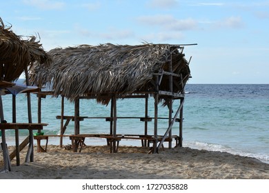empty straw hut on the beach, in sunny weather