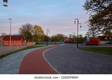 Empty Street (asphalt Road) Of A Small Town (village). Traditional And Modern Houses, Cottages. Tourism, Vacations, Home Office, Guest House, Real Estate Development, City Gardening, Lifestyle