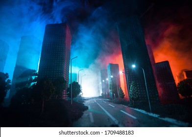 Empty street of burnt up city, flames on the ground and blasts with smoke in the distance. Apocalyptic view of city downtown as disaster film poster concept. Night scene. City destroyed by war.