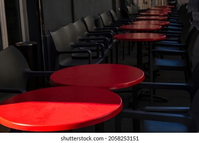 Empty Street Cafe. Round Red Tables With Gray Chairs. Close-up. 