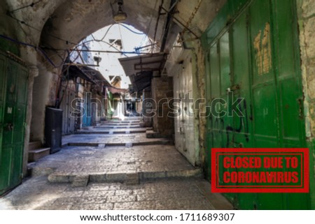 The empty street with closed shops in the Old City of Jerusalem. Following the coronavirus outbreak, the Israeli Government has decided for a massive curfew, leaving the Old Town totally deserted.