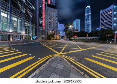 Empty street in downtown district of Hong Kong city at night