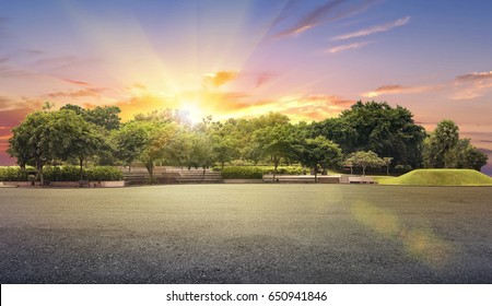 Empty street at the nice and comfortable garden under the sunset with sun flare - Powered by Shutterstock