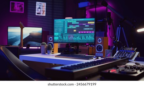 Empty studio at home equipped with mixing soundboard panel and other musical instruments, music industry recording. Modern space with electronic controls and daw software on pc. Camera B.