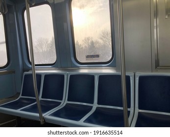 Empty subway car with sunlight peaking through on cold day in urban Chicago