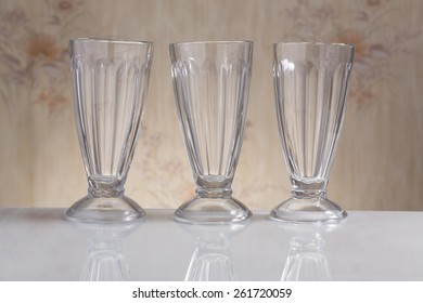 Lot Of Empty Sundae Glass On The Oldened Background