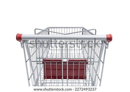 Empty supermarket shopping cart: grocery shopping and retail concept
