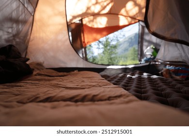 empty surface of sleeping bag in the camping tent