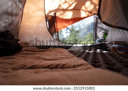 empty surface of sleeping bag in the camping tent