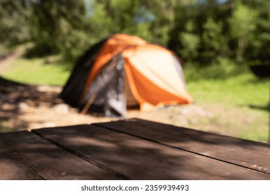 Empty surface of table on the background of tent - Powered by Shutterstock