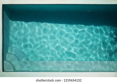 Empty Swimming Pool Above Top View On Sunny Day