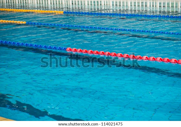 empty swimming pool with\
many lanes.