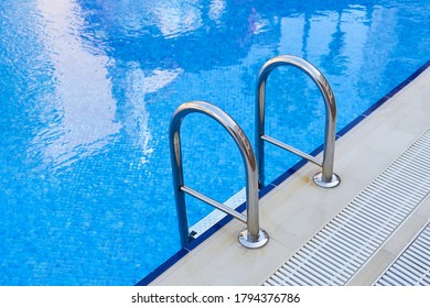 Empty Swimming Pool With Metal Ladder. Closed Hotels. Private Pool At Home