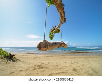 Empty Swing On Summer Tropical Beach Next To The Ocean. No People.