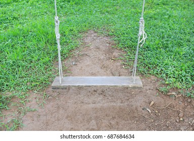 Empty swing placed in the garden - Shutterstock ID 687684634