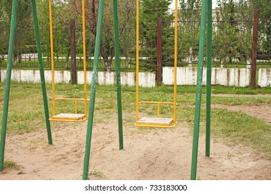 Empty swing in playground.