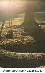 Empty Swingset In Beautiful Backlight