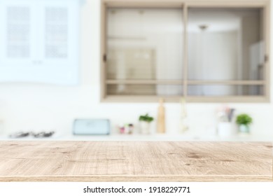 empty table board and defocused modern kitchen background. product display concept - Shutterstock ID 1918229771