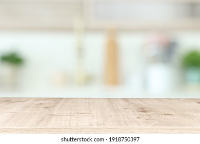 empty table board and defocused modern kitchen background. product display concept - Shutterstock ID 1918750397